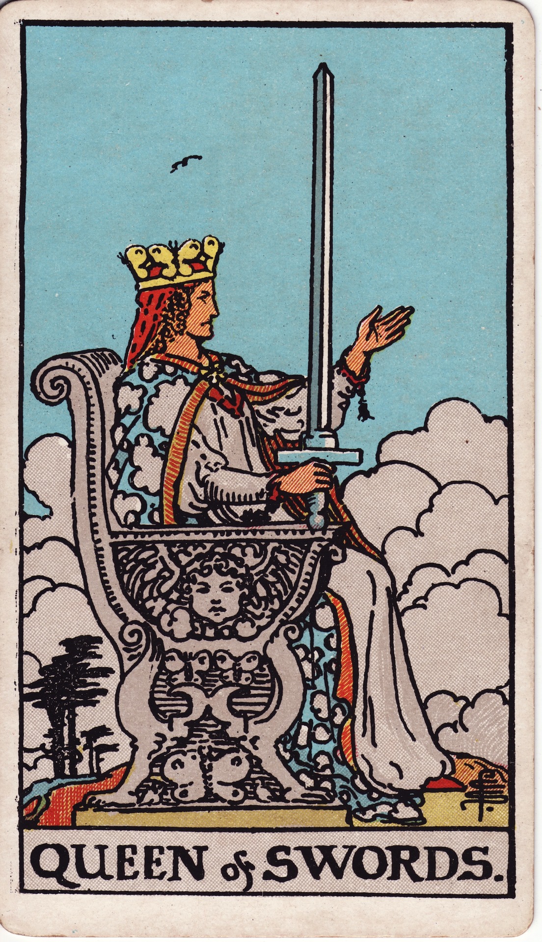 The Rider Waite Smith version of the Queen of Swords Tarot card, with a crowned woman sitting in profile on a throne, holding a sword upright in one hand, her other hand held out with upturned palm.